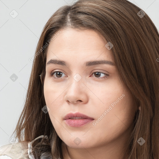 Neutral white young-adult female with long  brown hair and brown eyes