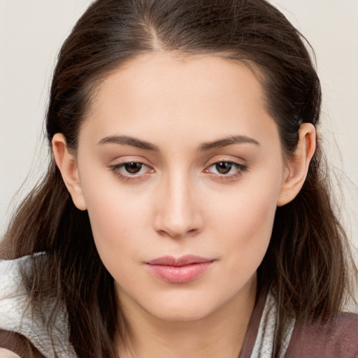 Neutral white young-adult female with long  brown hair and brown eyes