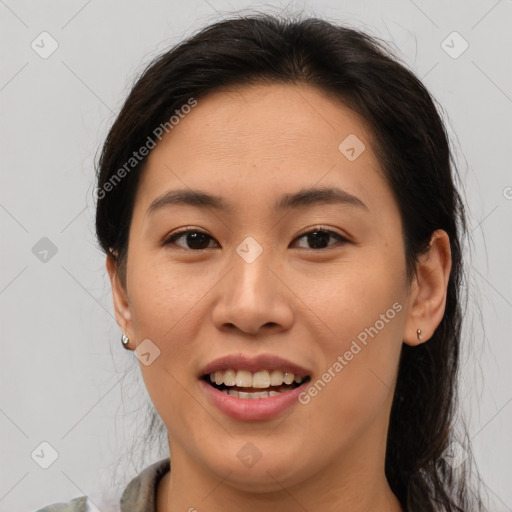 Joyful latino young-adult female with medium  brown hair and brown eyes