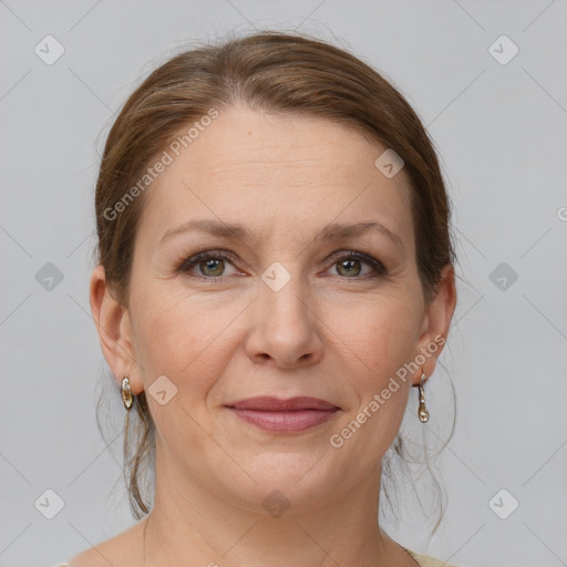 Joyful white adult female with medium  brown hair and grey eyes