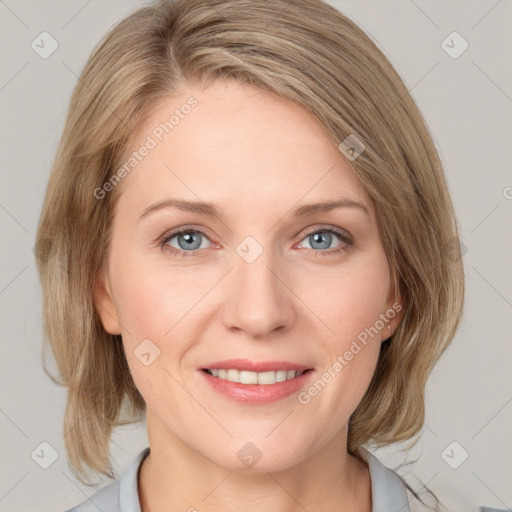 Joyful white young-adult female with medium  brown hair and blue eyes