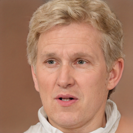 Joyful white middle-aged male with short  brown hair and brown eyes