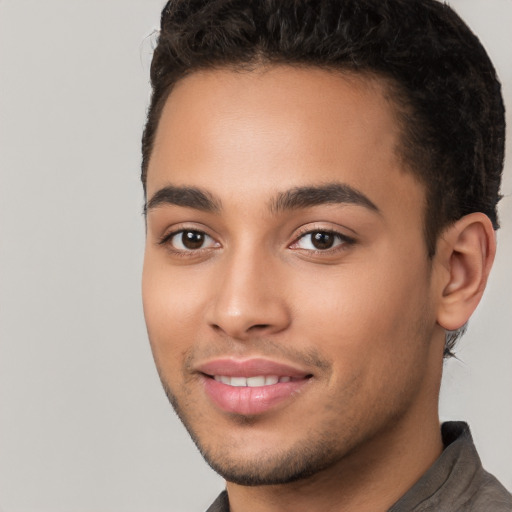 Joyful white young-adult male with short  black hair and brown eyes