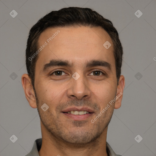 Joyful white young-adult male with short  black hair and brown eyes