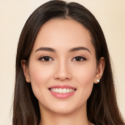 Joyful white young-adult female with long  brown hair and brown eyes