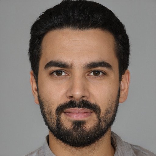 Neutral latino young-adult male with short  black hair and brown eyes
