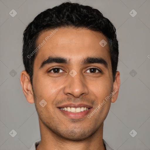 Joyful latino young-adult male with short  black hair and brown eyes