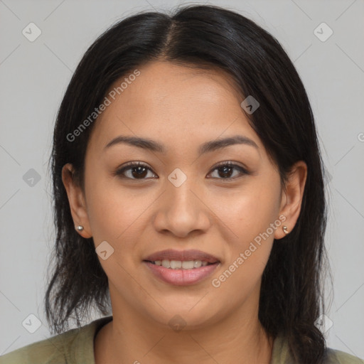 Joyful latino young-adult female with medium  brown hair and brown eyes