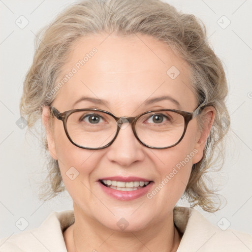 Joyful white adult female with medium  brown hair and blue eyes