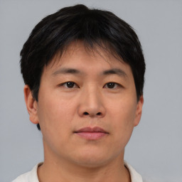 Neutral asian young-adult male with short  brown hair and brown eyes