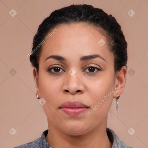 Joyful latino young-adult female with short  black hair and brown eyes