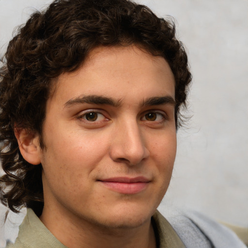 Joyful white young-adult male with medium  brown hair and brown eyes