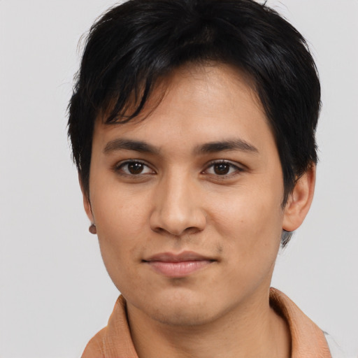 Joyful asian young-adult male with short  black hair and brown eyes