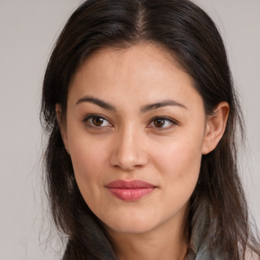 Joyful white young-adult female with long  brown hair and brown eyes