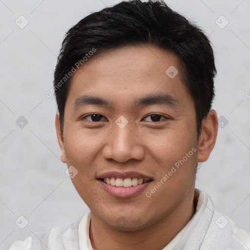 Joyful asian young-adult male with short  brown hair and brown eyes