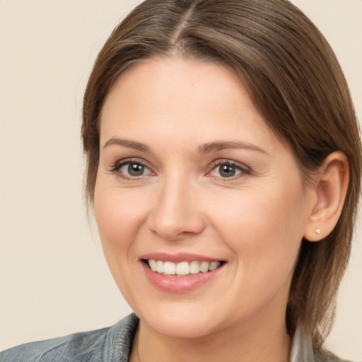 Joyful white young-adult female with medium  brown hair and brown eyes