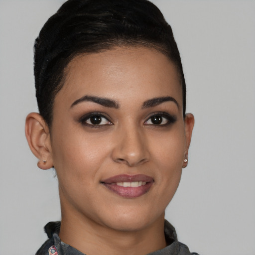 Joyful latino young-adult female with short  brown hair and brown eyes