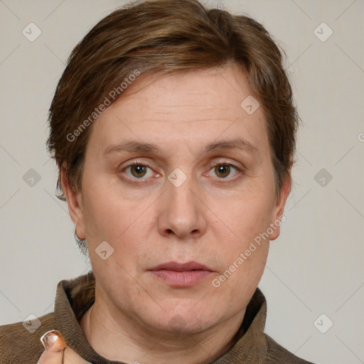 Joyful white adult female with short  brown hair and grey eyes