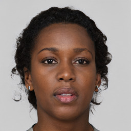 Neutral black young-adult female with short  brown hair and brown eyes