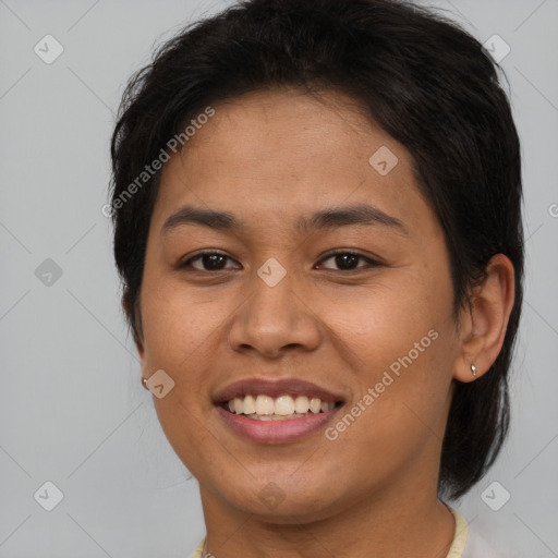 Joyful asian young-adult female with short  brown hair and brown eyes