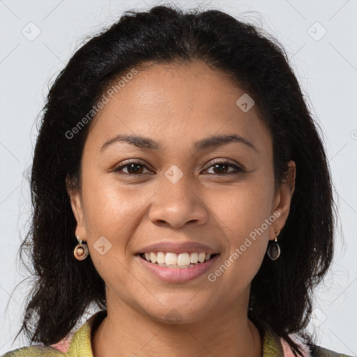 Joyful latino young-adult female with long  brown hair and brown eyes