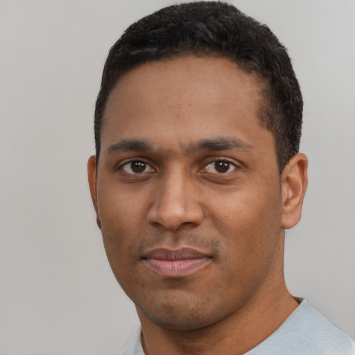 Neutral black young-adult male with short  black hair and brown eyes