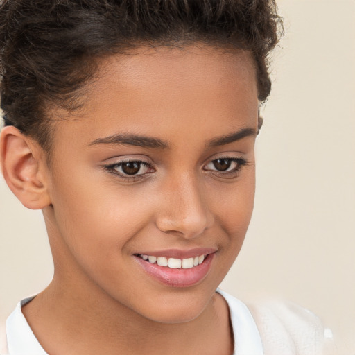 Joyful white child female with short  brown hair and brown eyes