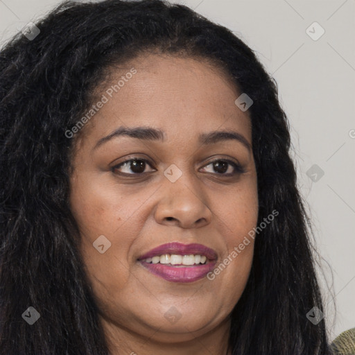 Joyful black young-adult female with long  brown hair and brown eyes