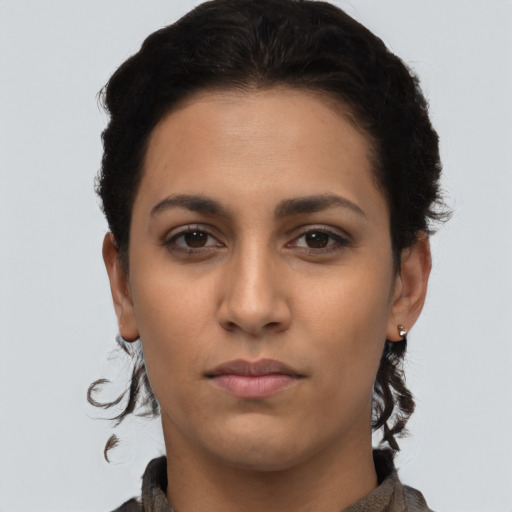Neutral latino young-adult female with short  black hair and brown eyes