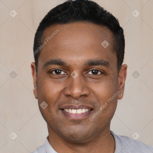 Joyful latino young-adult male with short  black hair and brown eyes