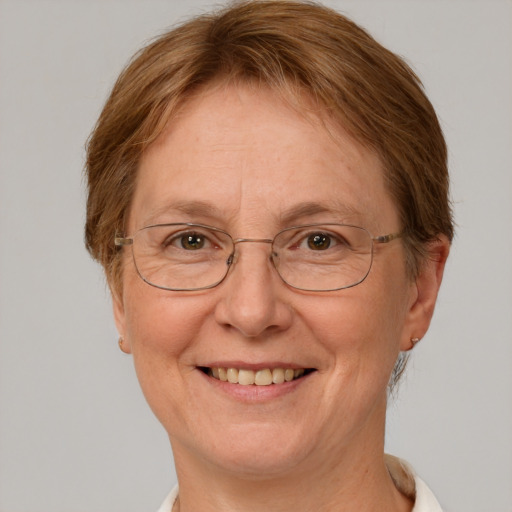 Joyful white middle-aged female with short  brown hair and green eyes