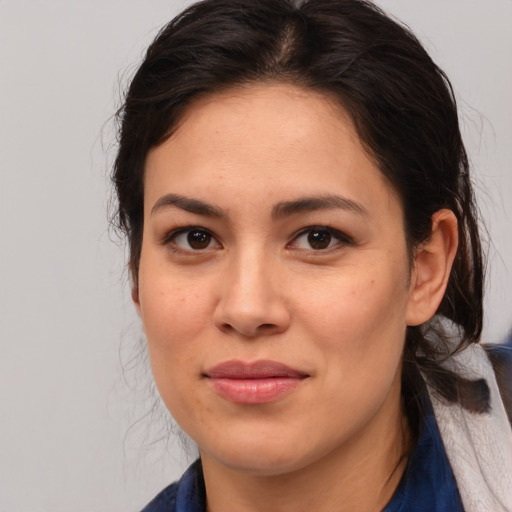 Joyful asian young-adult female with medium  brown hair and brown eyes