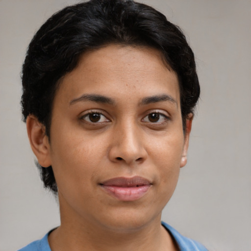 Joyful latino young-adult female with short  brown hair and brown eyes