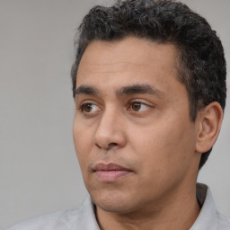 Neutral white adult male with short  black hair and brown eyes