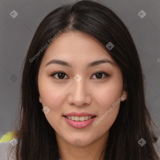 Joyful asian young-adult female with long  brown hair and brown eyes