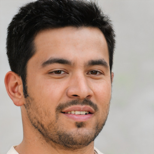 Joyful latino young-adult male with short  brown hair and brown eyes