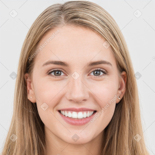 Joyful white young-adult female with long  brown hair and green eyes