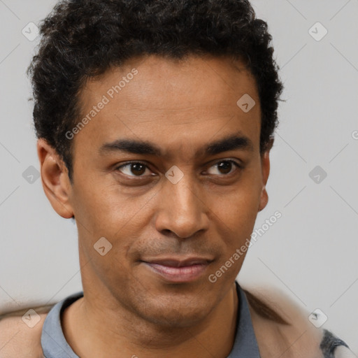 Joyful latino young-adult male with short  brown hair and brown eyes