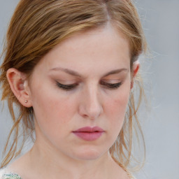 Neutral white young-adult female with medium  brown hair and blue eyes