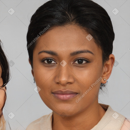 Joyful black young-adult female with medium  brown hair and brown eyes