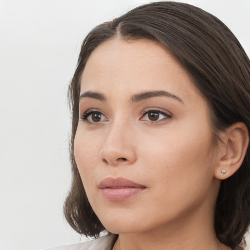 Neutral white young-adult female with long  brown hair and brown eyes