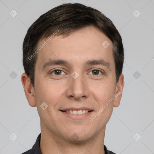 Joyful white young-adult male with short  brown hair and grey eyes