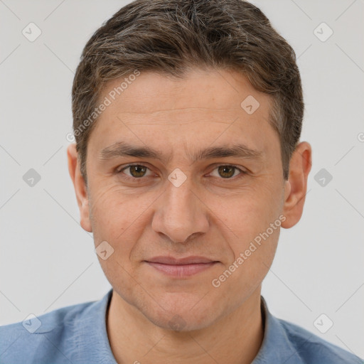 Joyful white adult male with short  brown hair and brown eyes