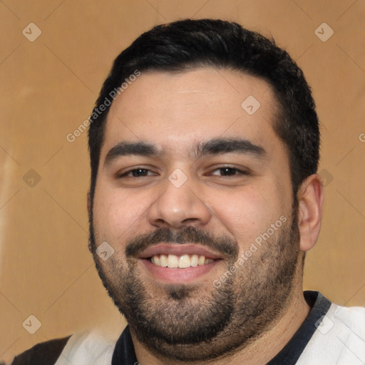 Joyful white young-adult male with short  black hair and brown eyes