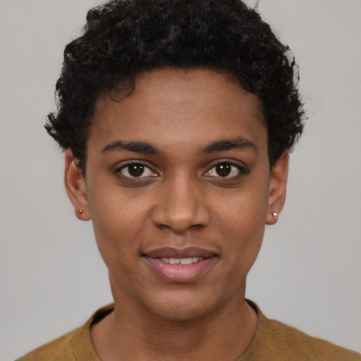 Joyful black young-adult female with short  black hair and brown eyes