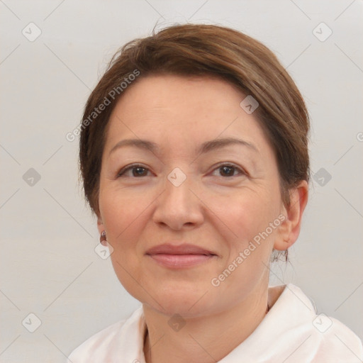 Joyful white adult female with short  brown hair and brown eyes