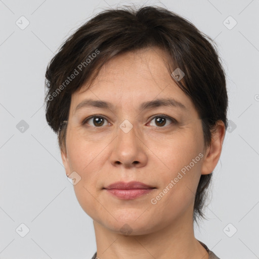 Joyful white adult female with medium  brown hair and brown eyes