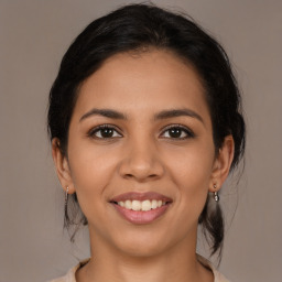 Joyful latino young-adult female with medium  brown hair and brown eyes