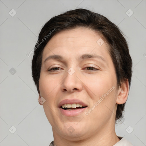 Joyful white adult female with short  brown hair and brown eyes