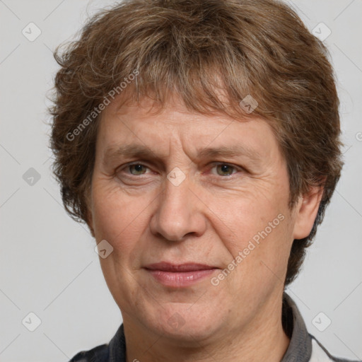 Joyful white adult male with short  brown hair and grey eyes